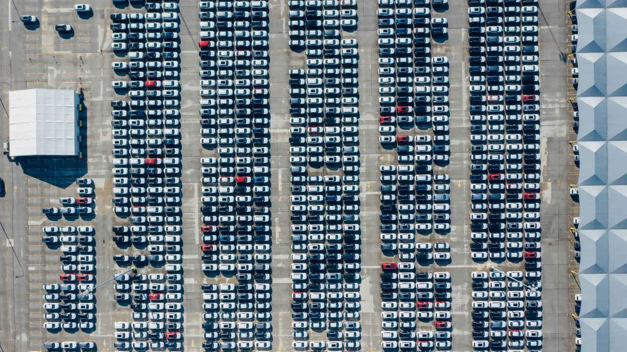 Rows of vehicles in a large automotive market