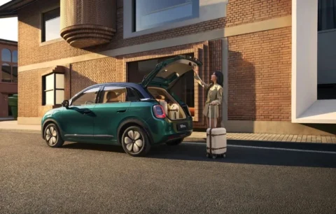 Green Wuling Bingo Pro with rear tailgate open for luggage access
